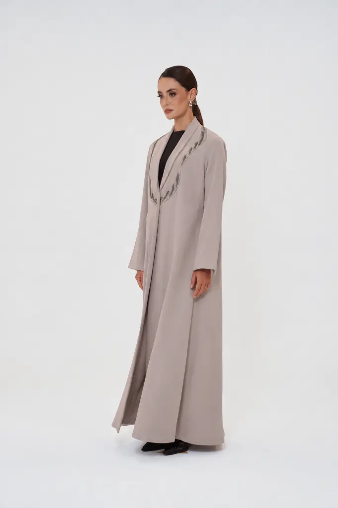 Model in a bright neutral studio-1.webp