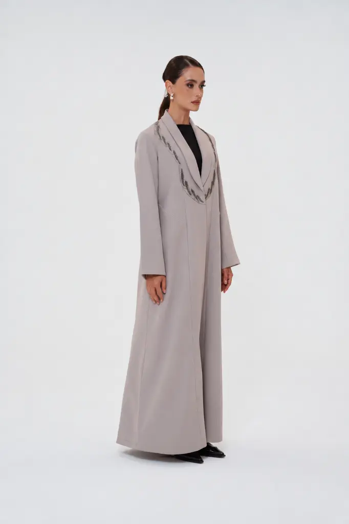 Fashion model in a soft-gray studio-2.webp